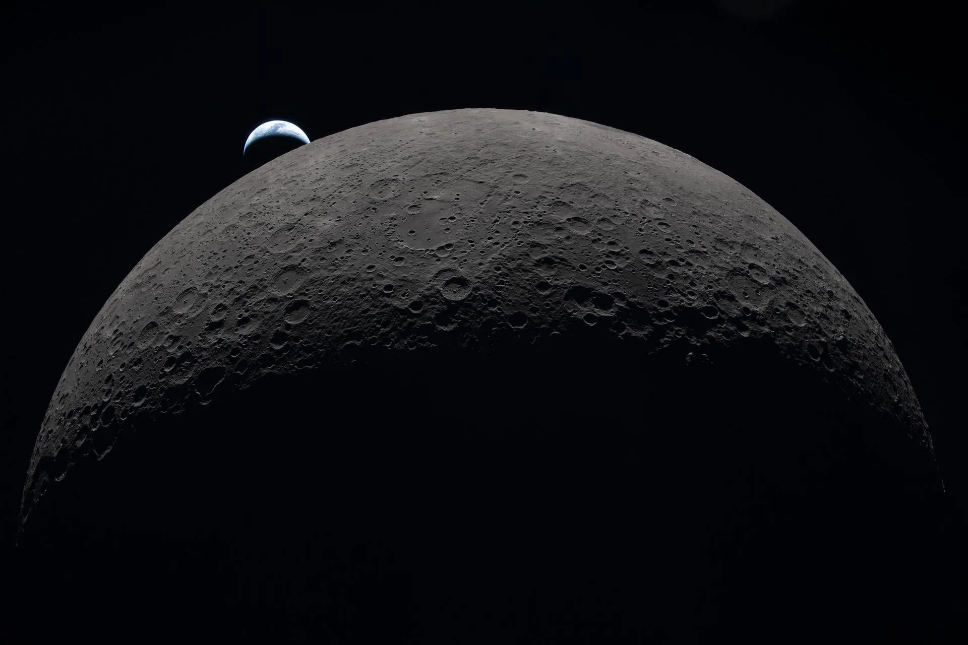 Earthset photographed by the Artemis II crew, Earth setting below the lunar horizon